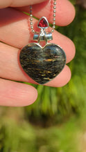 Load and play video in Gallery viewer, Nuummite and Garnet silver heart pendant
