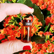 Indlæs billede til gallerivisning Small amber glass bottle with cork necklace - with patina
